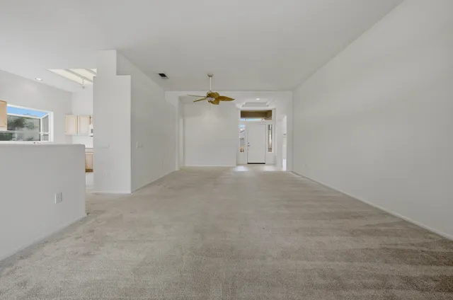 a view of a livingroom with wooden cabinets