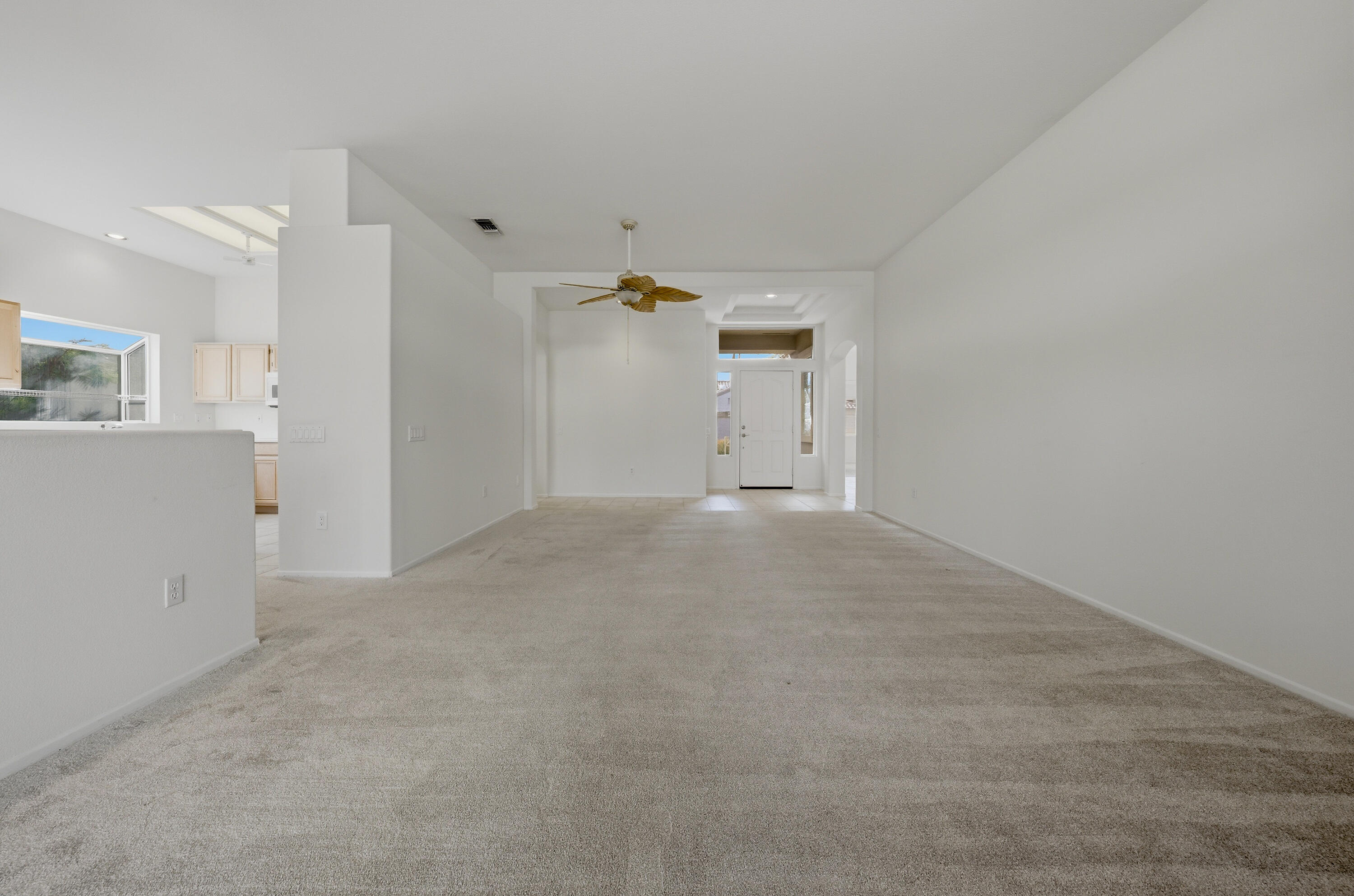 78764 Putting Green Drive Palm Desert, CA 92211 - Photo 8 of 23 a view of a livingroom with wooden cabinets
