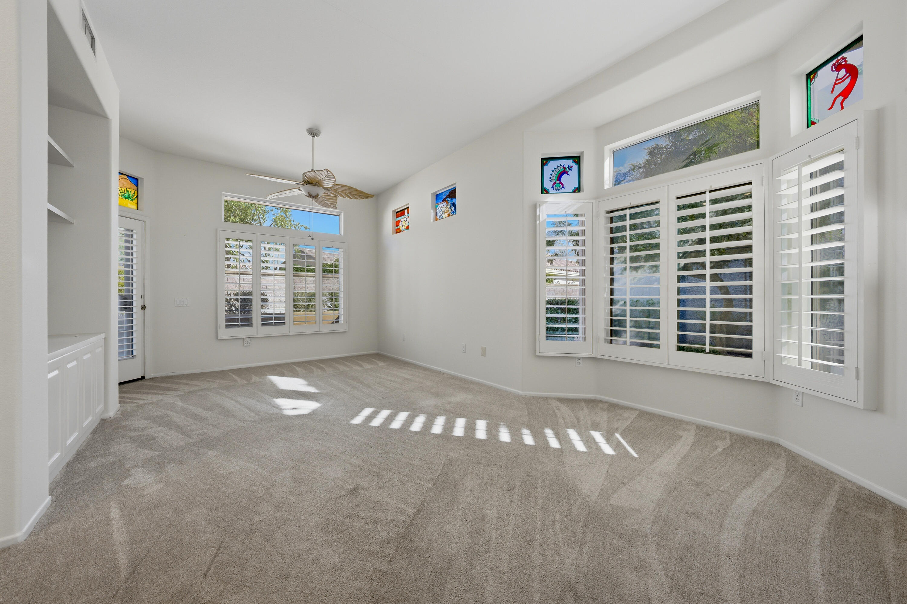 78764 Putting Green Drive Palm Desert, CA 92211 - Photo 10 of 23 a view of an empty room with a window