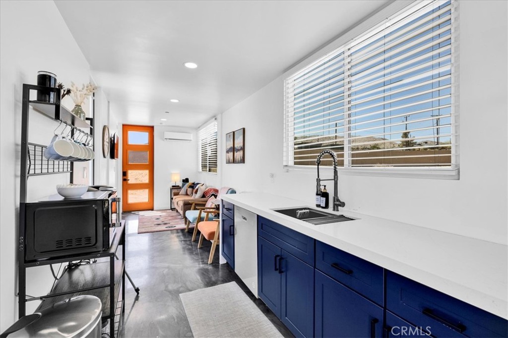 6816 Saddleback Road Joshua Tree, CA 92252 - Photo 11 of 71 a view of a livingroom with furniture and window