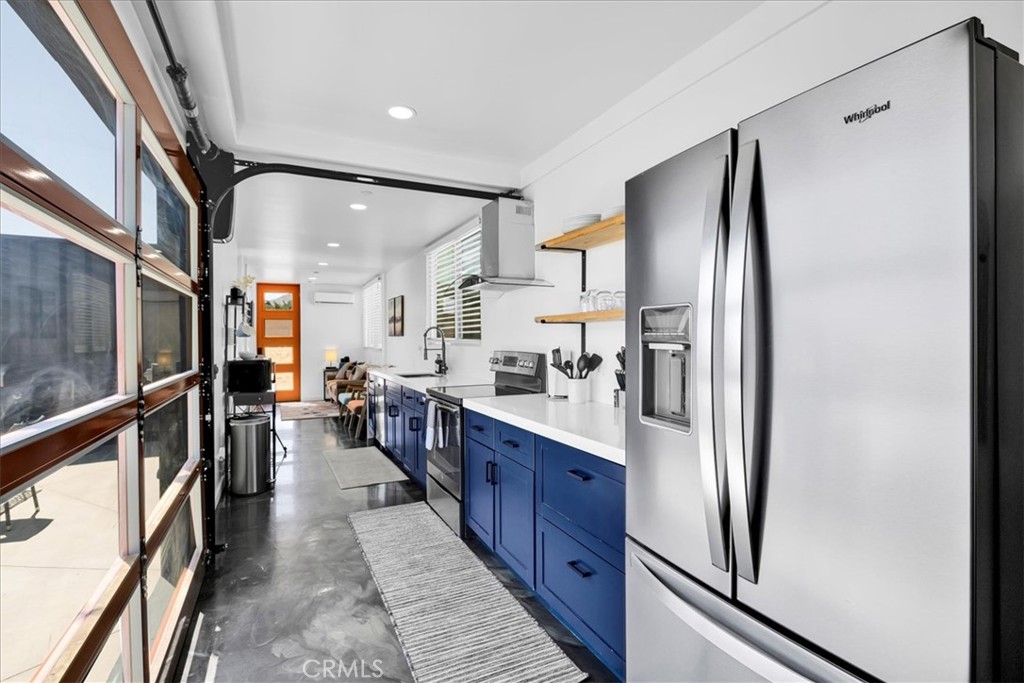 6816 Saddleback Road Joshua Tree, CA 92252 - Photo 12 of 71 a large kitchen with stainless steel appliances a refrigerator and a sink