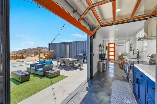a kitchen with stainless steel appliances sink stove and cabinets