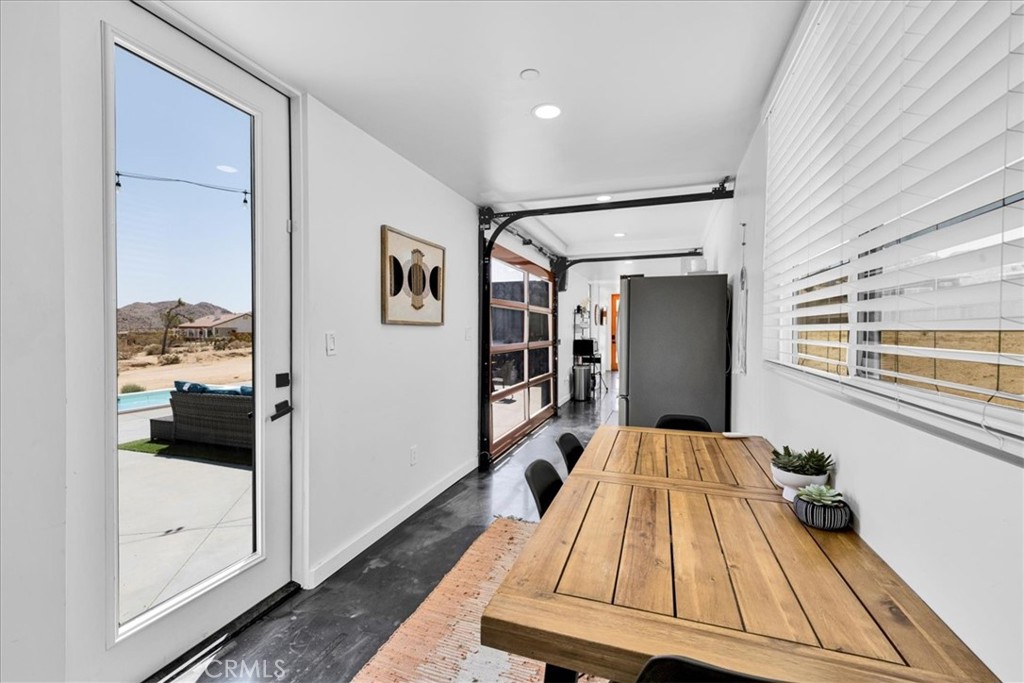 6816 Saddleback Road Joshua Tree, CA 92252 - Photo 18 of 71 a bedroom with a bed and a refrigerator