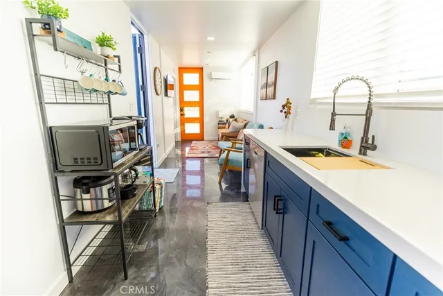a view of a bedroom with washer and dryer