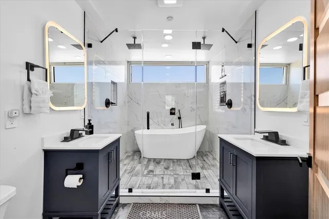 a view of a city from a balcony with furniture