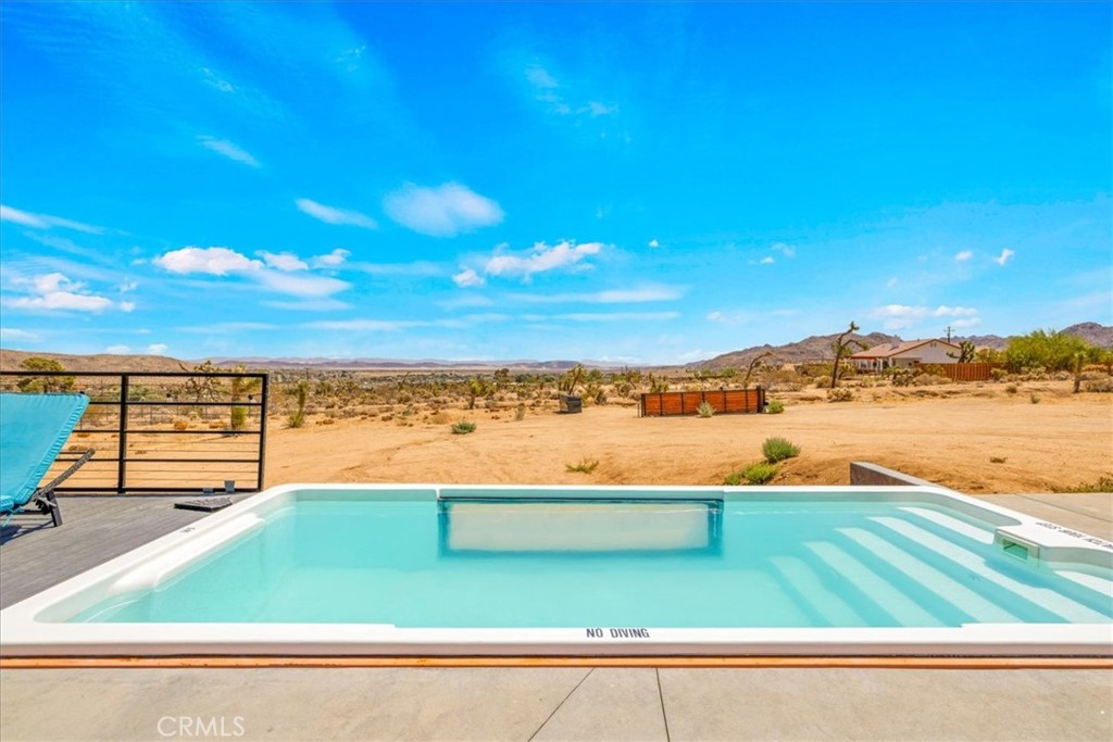 6816 Saddleback Road Joshua Tree, CA 92252 - Photo 35 of 71 a view of a lake with a ocean view