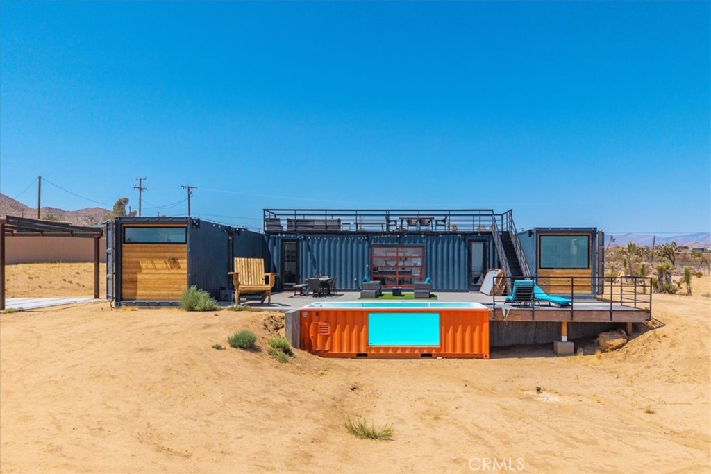 6816 Saddleback Road Joshua Tree, CA 92252 - Photo 45 of 71 a view of a swimming pool with a patio