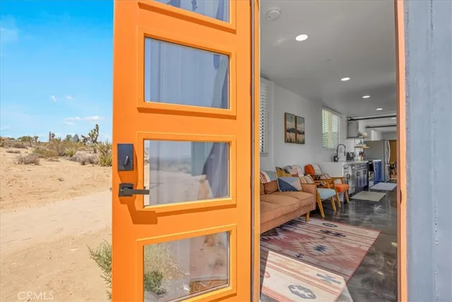 a kitchen with stainless steel appliances a sink a stove and cabinets