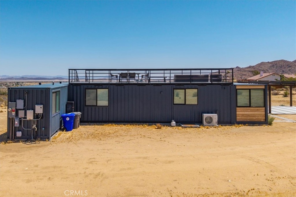 6816 Saddleback Road Joshua Tree, CA 92252 - Photo 66 of 71 a view of a house with a yard