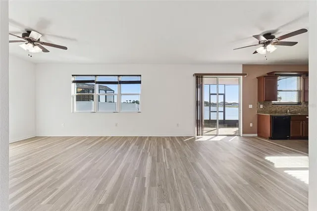 a view of a kitchen with a sink and a refrigerator