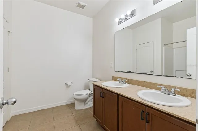 an empty room with a view of a house