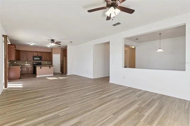 a kitchen with granite countertop stainless steel appliances and sink