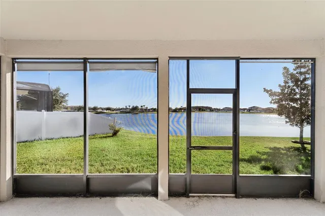 an aerial view of a house with a ocean view