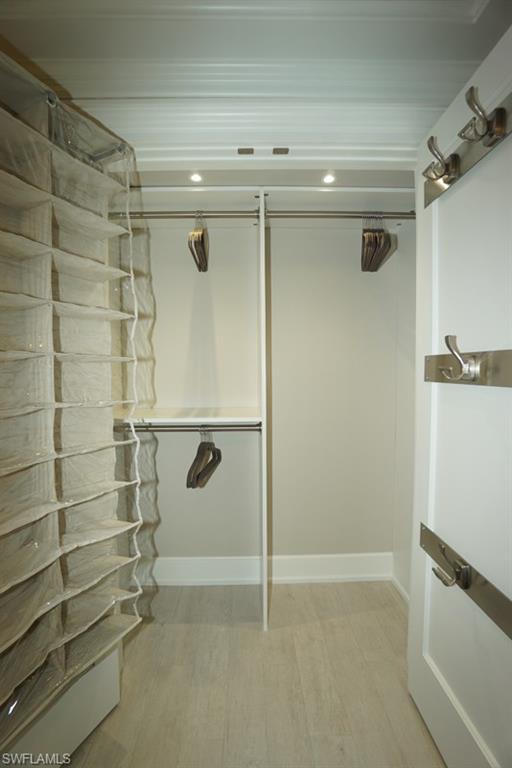 480 5th Street South, Unit 102 Naples, FL 34102 - Photo 14 of 24 a bathroom with a shower and a tub