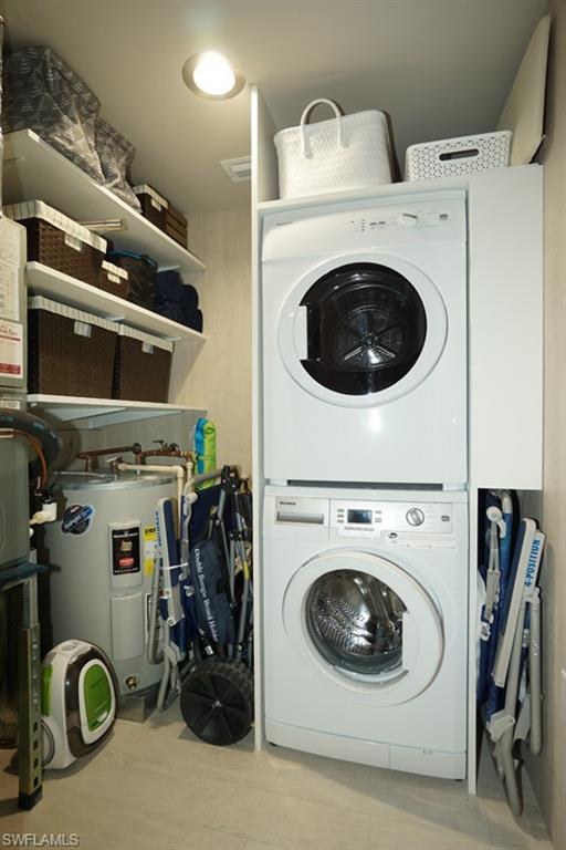 480 5th Street South, Unit 102 Naples, FL 34102 - Photo 19 of 24 a utility room with dryer washer and other items