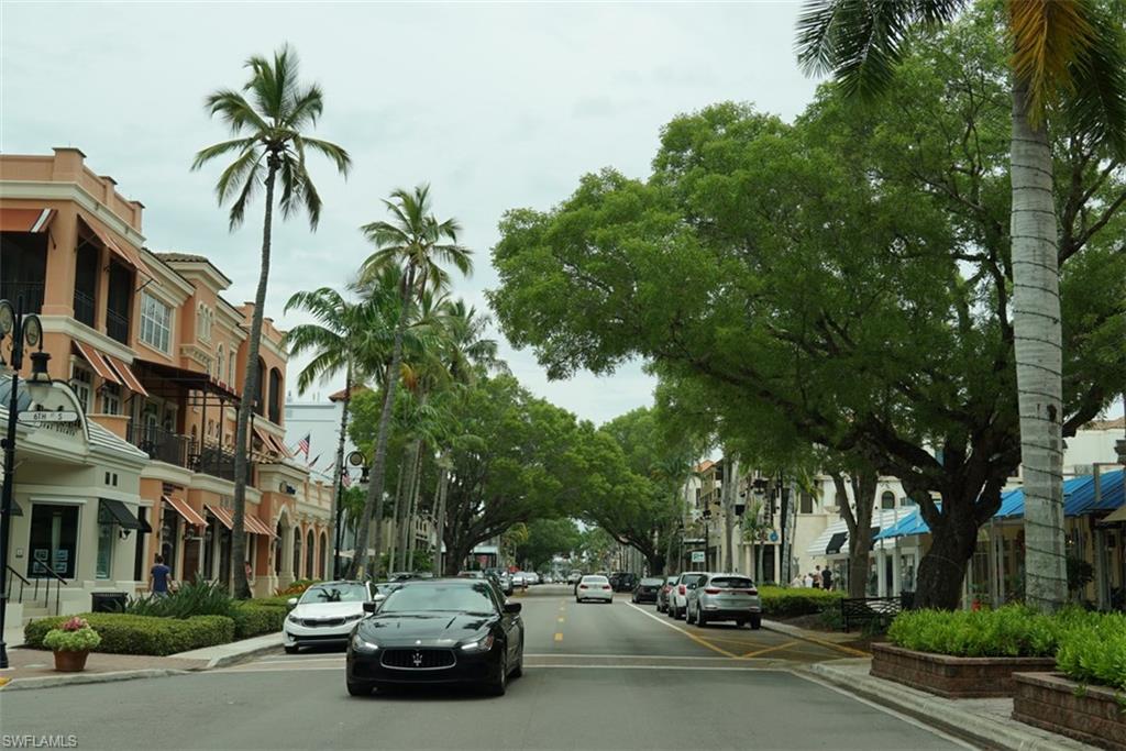 480 5th Street South, Unit 102 Naples, FL 34102 - Photo 22 of 24 a car parked on the side of a street