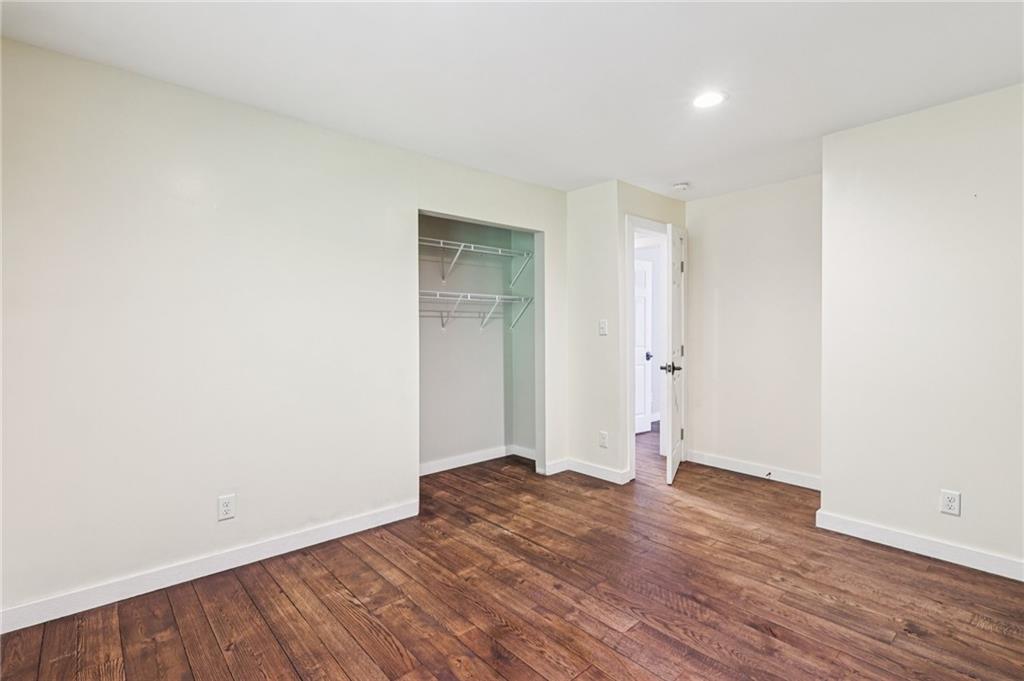 1188 East Lake Road Transfer, PA 16154 - Photo 14 of 32 an empty room with wooden floor