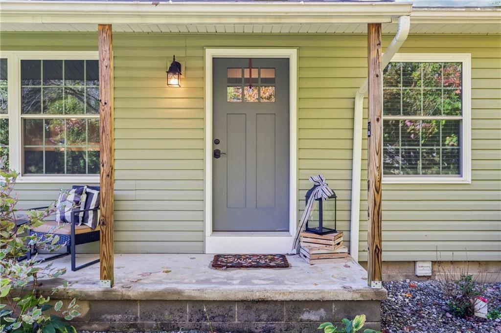 1188 East Lake Road Transfer, PA 16154 - Photo 3 of 32 a front view of a house with a porch