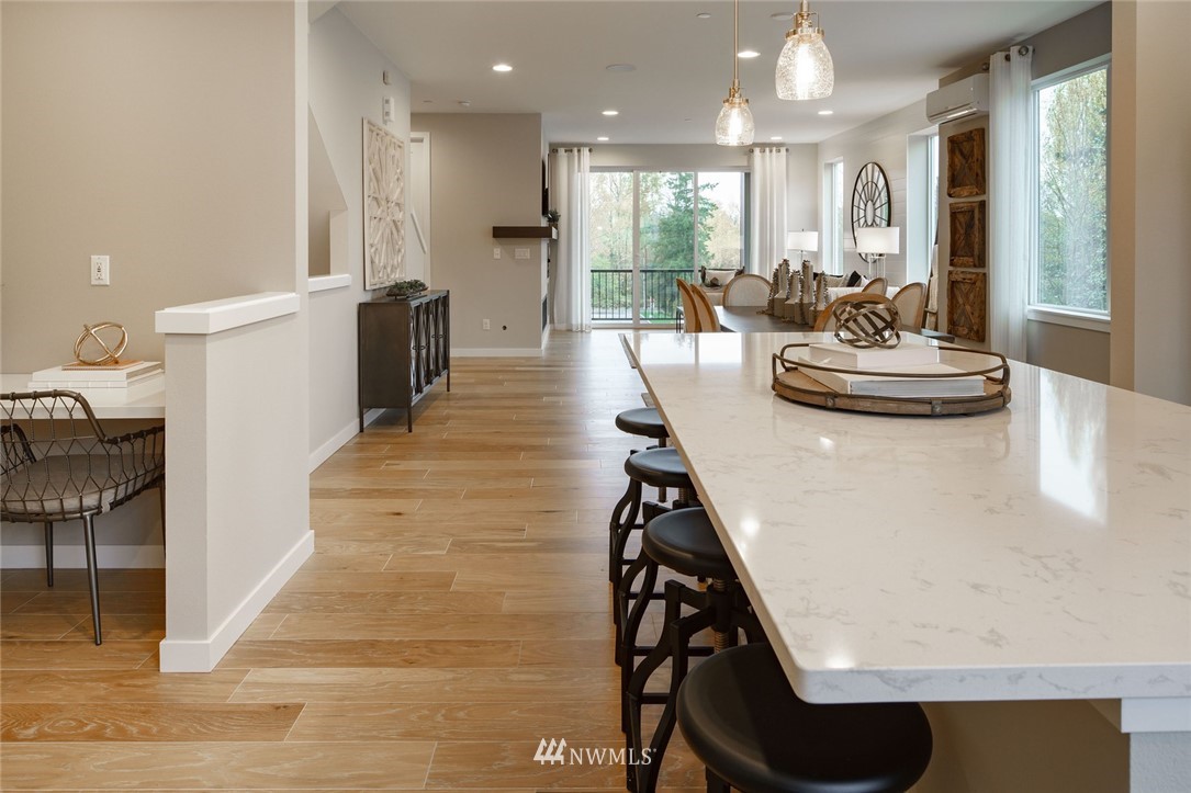 23711 9th (lot 74) Avenue Southeast, Unit E Bothell, WA 98021 - Photo 6 of 21 a dining room with furniture and wooden floor
