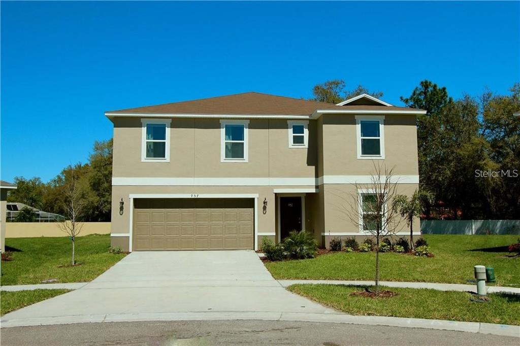 957 Emerald Green Court Kissimmee, FL 34746 - Photo 1 of 29 a front view of a house with a yard