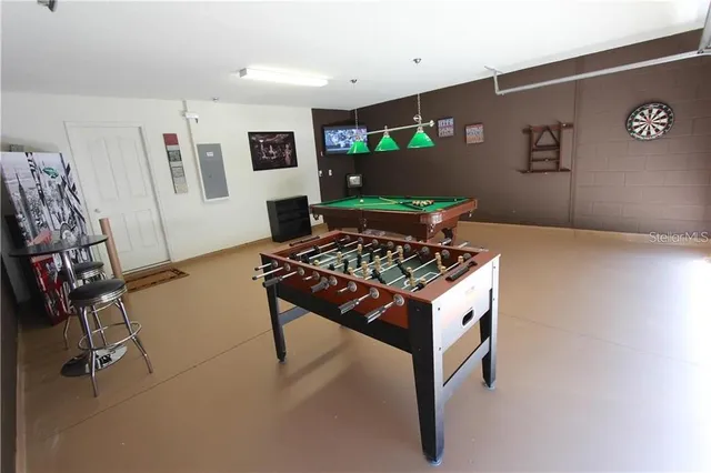 a kitchen with stainless steel appliances granite countertop a stove and a refrigerator