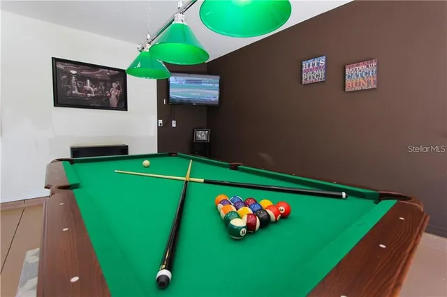 a room with green walls and a swimming pool