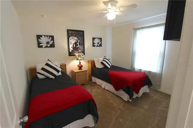 a bedroom with furniture and a chandelier
