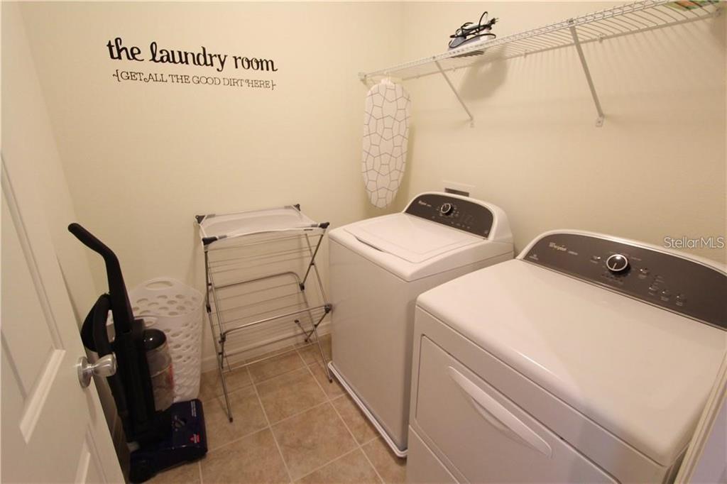 957 Emerald Green Court Kissimmee, FL 34746 - Photo 17 of 29 a utility room with dryer and washer