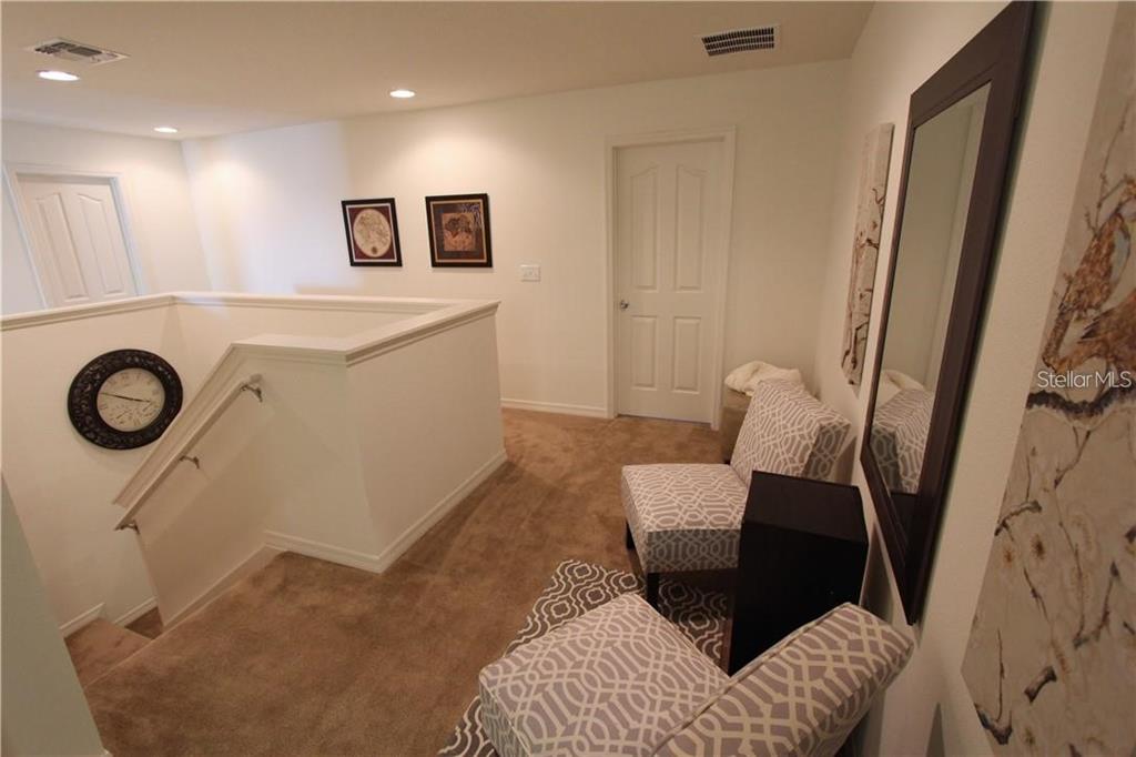 957 Emerald Green Court Kissimmee, FL 34746 - Photo 20 of 29 a bathroom with a sink and a mirror