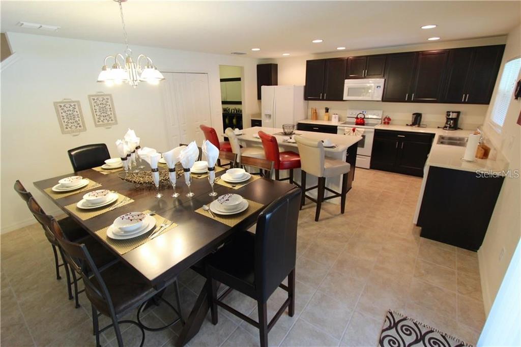 957 Emerald Green Court Kissimmee, FL 34746 - Photo 5 of 29 a view of a dining room with furniture