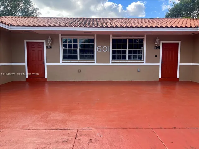 a view of a house with an empty space and a window