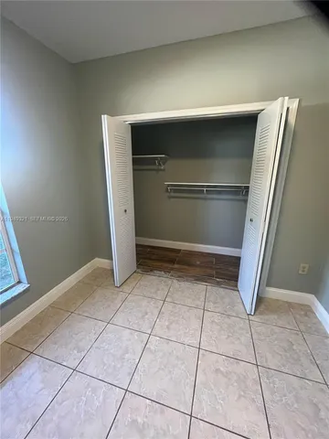 a view of an empty room and window