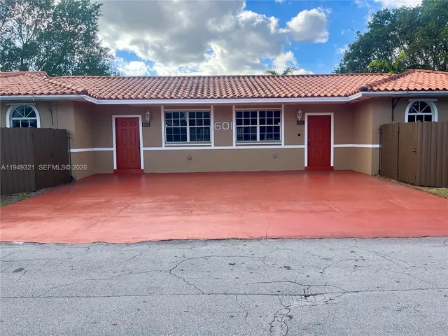 a front view of a house with a garage