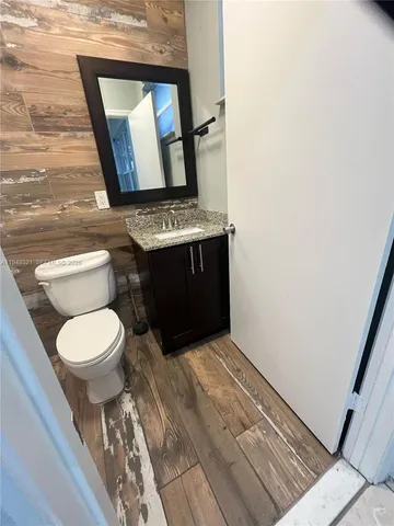a bathroom with a toilet and a bathtub