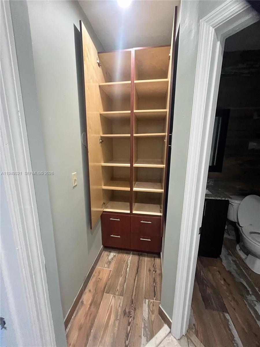 603 Northwest 97th Street, Unit 603 Miami, FL 33150 - Photo 26 of 28 a view of closet area