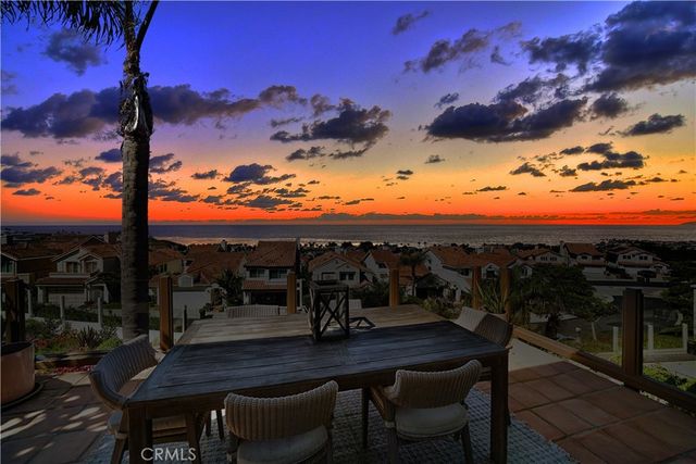 a view of a chairs and table in patio