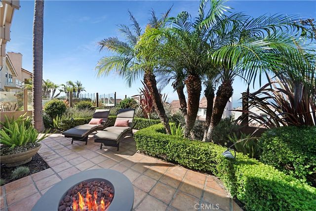 a view of a patio with couches and a table and chairs