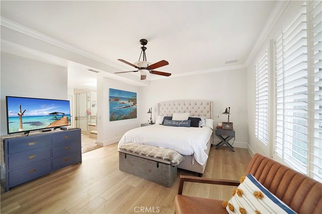 a bedroom with a bed a couch and dresser