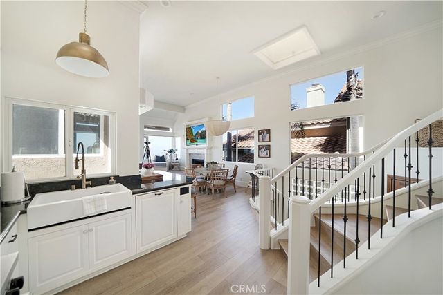 a kitchen with lots of appliances a sink and cabinets