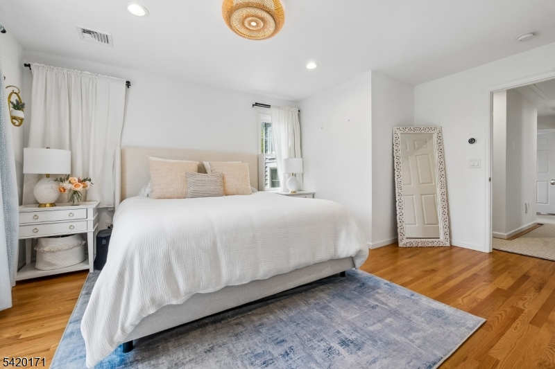 41 Milton Avenue Summit, NJ 07901 - Photo 13 of 39 a bedroom with a bed and a view of living room