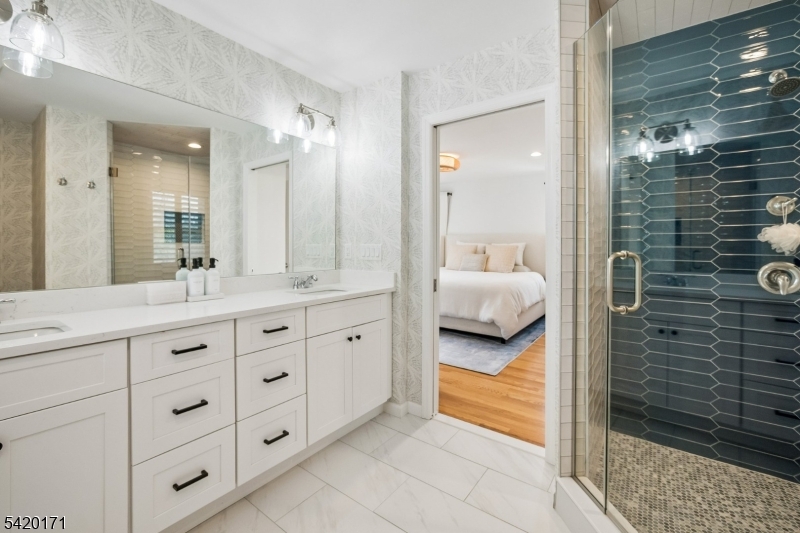 41 Milton Avenue Summit, NJ 07901 - Photo 15 of 39 a en suite bathroom with a double vanity sink and a mirror
