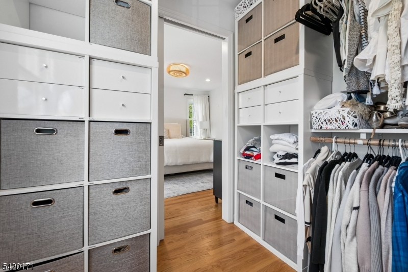 41 Milton Avenue Summit, NJ 07901 - Photo 17 of 39 a view of walk in closet with clothes and shoes