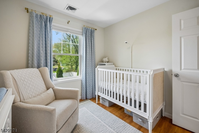 41 Milton Avenue Summit, NJ 07901 - Photo 21 of 39 a bed sitting in a bedroom next to a window