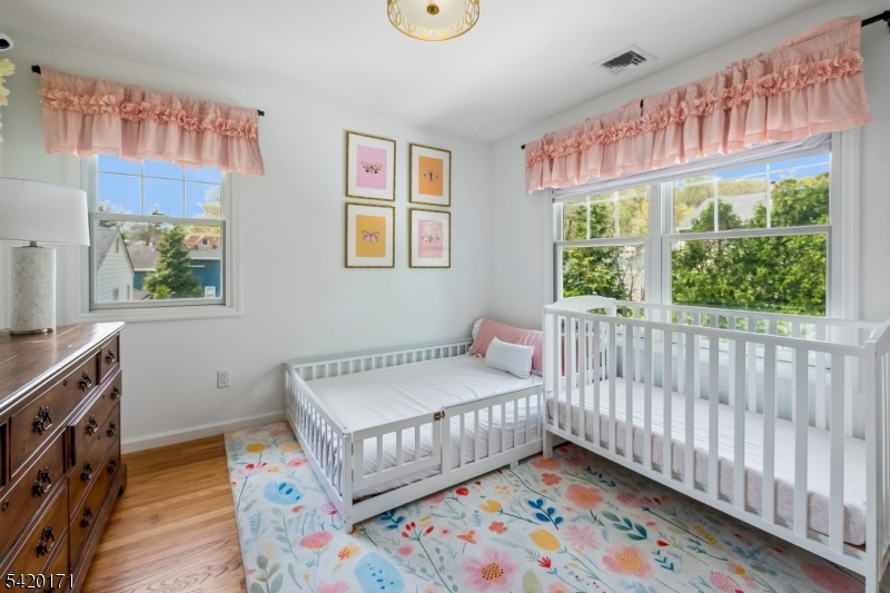 41 Milton Avenue Summit, NJ 07901 - Photo 22 of 39 a bedroom with furniture and a window