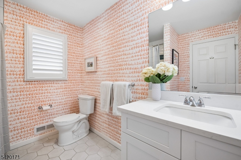 41 Milton Avenue Summit, NJ 07901 - Photo 25 of 39 a bathroom with a sink a toilet and mirror
