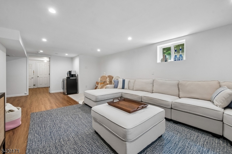 41 Milton Avenue Summit, NJ 07901 - Photo 30 of 39 a living room with furniture and a wooden floor