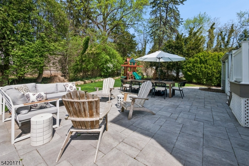 41 Milton Avenue Summit, NJ 07901 - Photo 35 of 39 a view of a tables and chairs under an umbrella