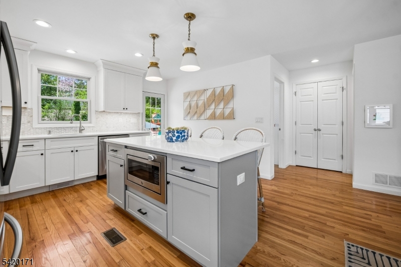 41 Milton Avenue Summit, NJ 07901 - Photo 8 of 39 a view of a kitchen with a sink a refrigerator and window