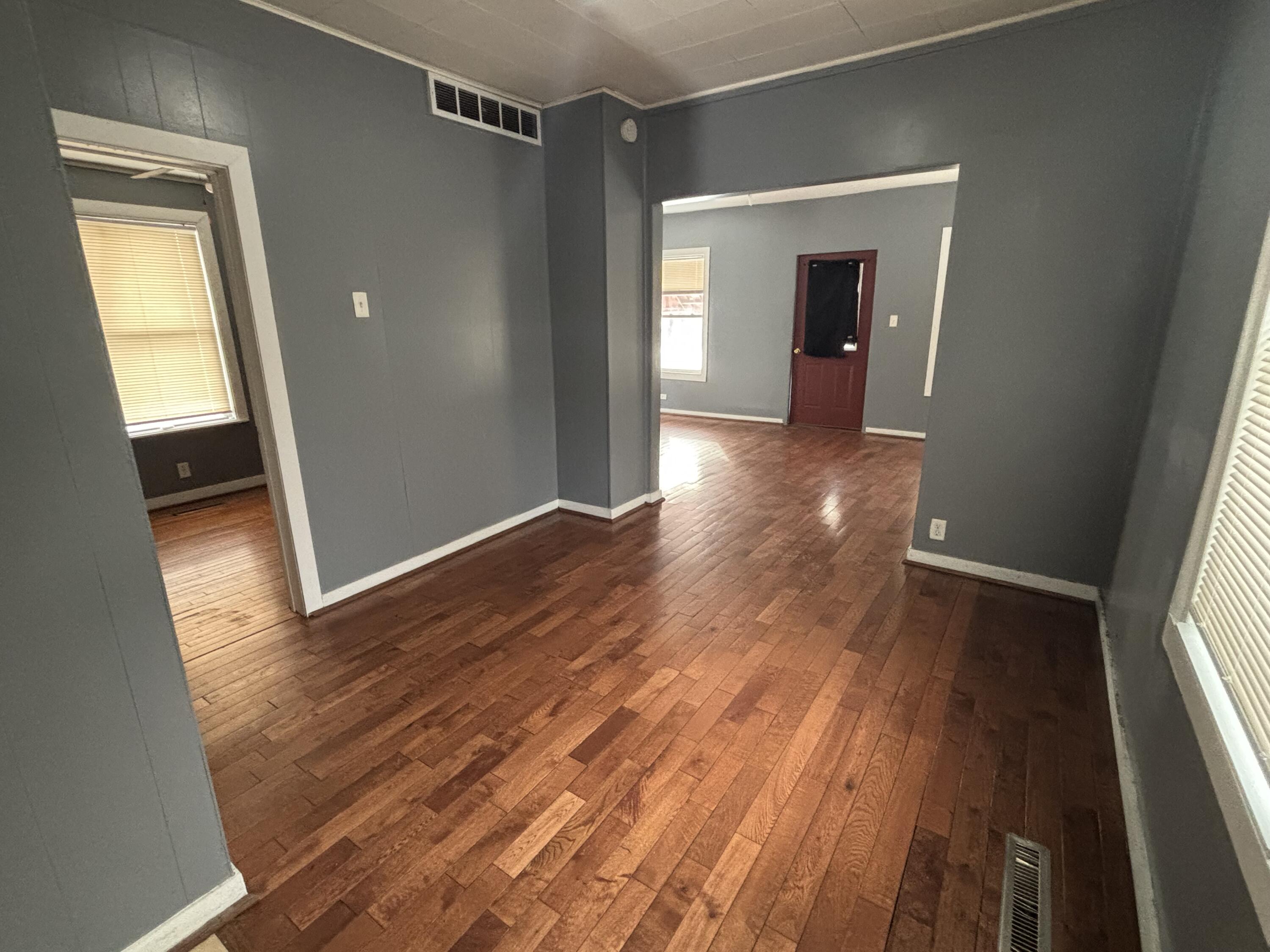 3953 Monroe Street Gary, IN 46408 - Photo 11 of 13 a view of hallway with wooden floor