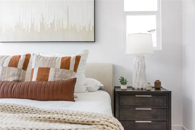 a bedroom with a bed and window